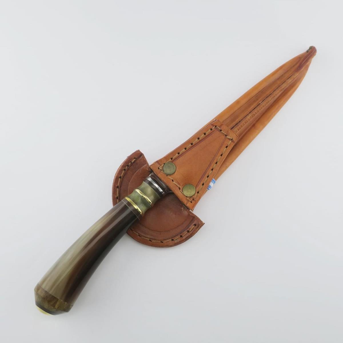 A 7.1-inch combined cow stainless steel knife with a polished handle and a fitted brown leather sheath, perfect for hunting, camping, or display.