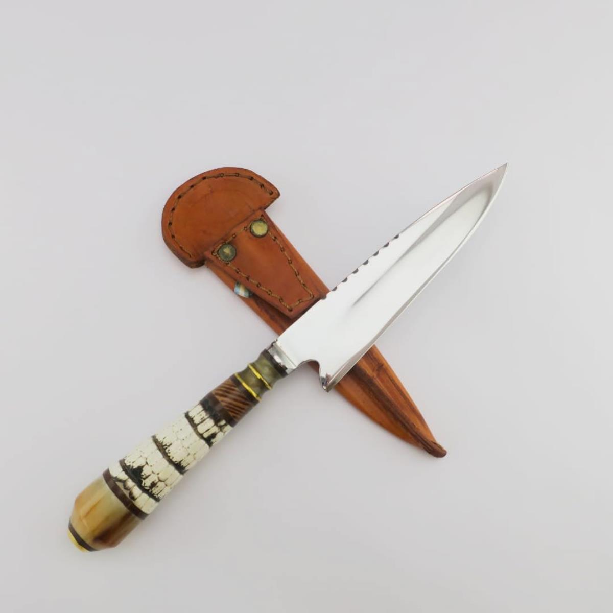 Armadillo Tail 5.5 inch stainless steel knife with a decorated handle and a brown leather sheath.