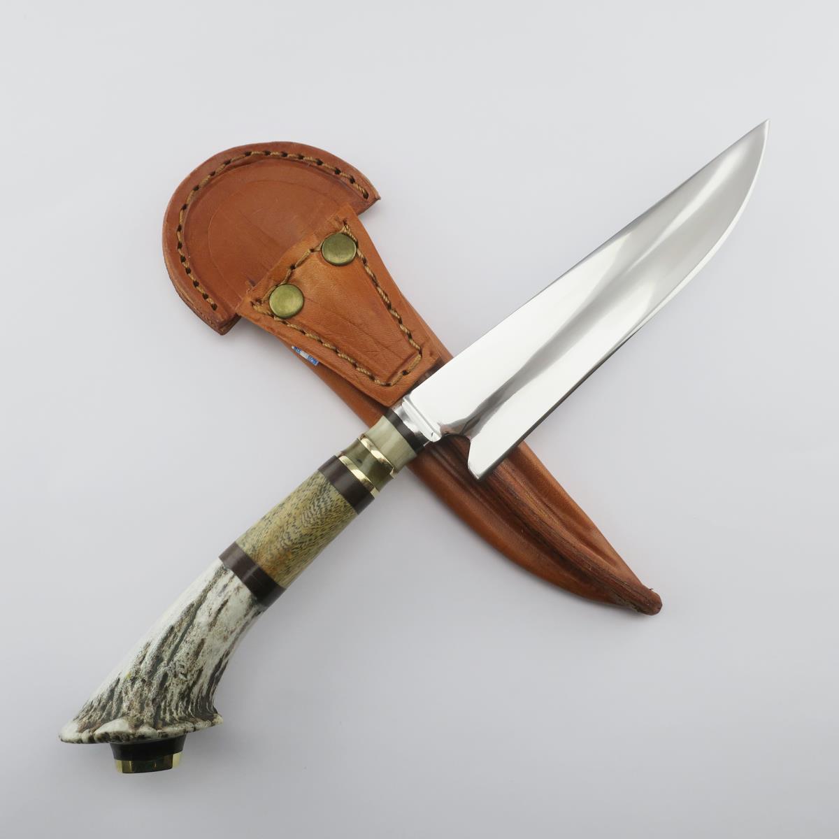 Deer 5.5 inch stainless steel knife with antler handle and brown leather sheath, perfect for hunting, camping, and outdoor activities. Durable blade and secure fit.
